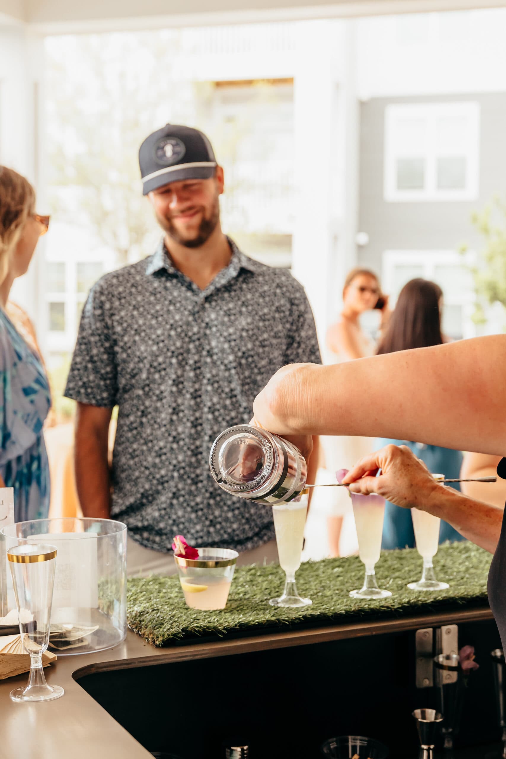 Bartender serving guests at an outdoor event
